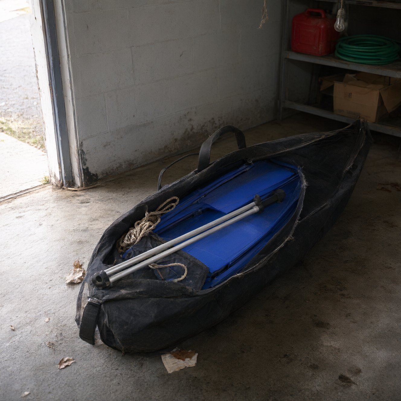 Padded carry bag containing the folded boat standing upright